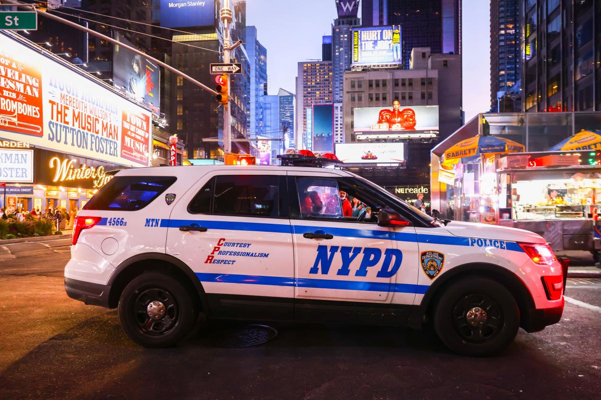 Shocking video shows wrong-way BMW racing off, hurling armed cop to ground in Times Square
