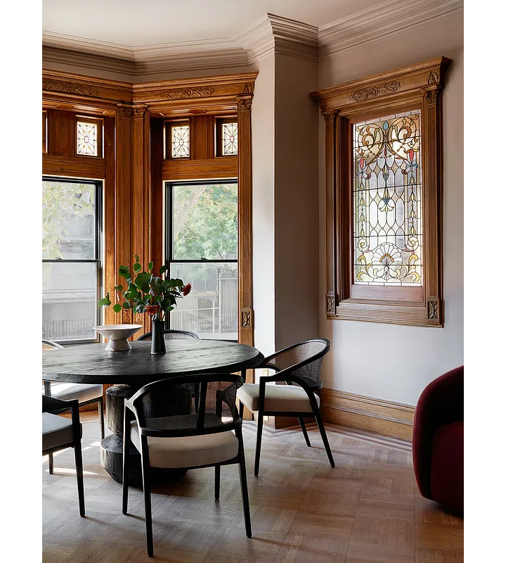 parlor with wood moldings and stained glass
