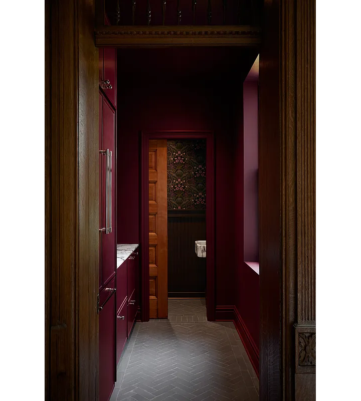 pantry with red cabinets