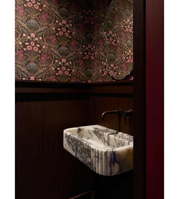 powder room with marble sink