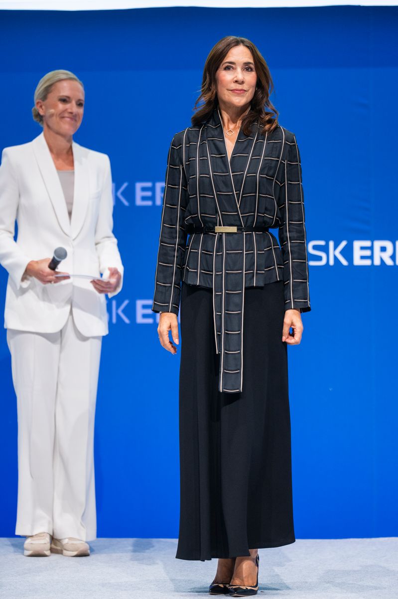 The Danish Queen put a modern spin on power dressing with a graphic tailored suit cinched at the waist with a slim belt.
