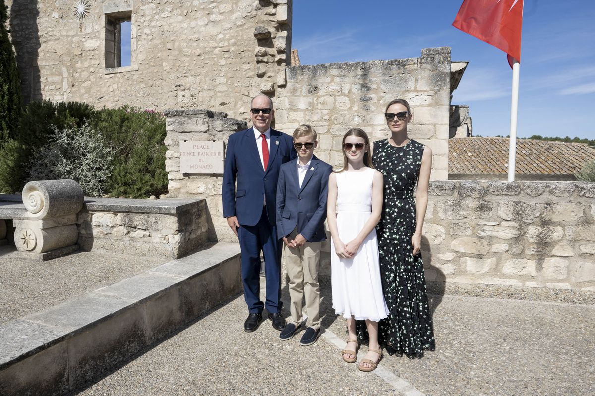 Princess Charlene steps out with her family in a black dress reminiscent of one Queen Letizia wore a decade ago