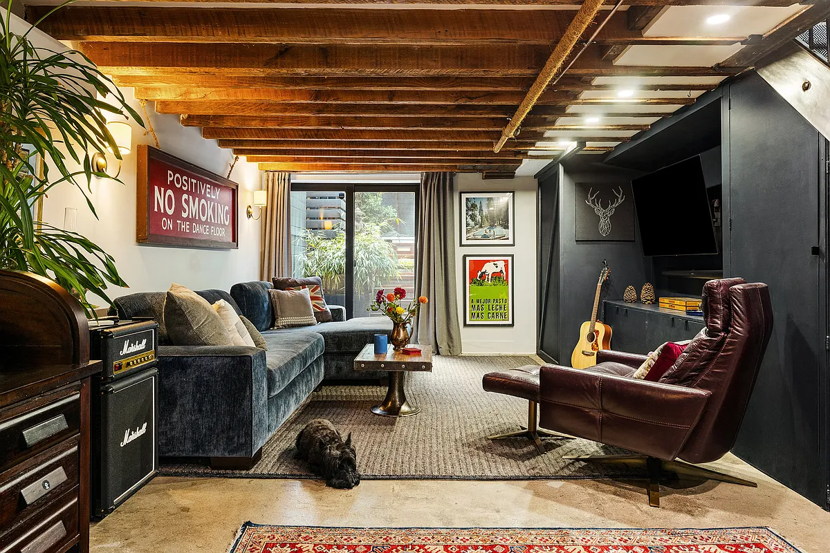 garden level den with exposed beams