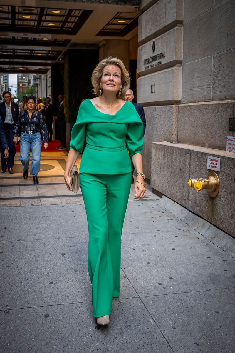 Queen Mathilde made a colorful statement on the streets of New York in a striking green pantsuit with a sculptural silhouette.