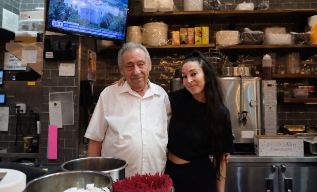 Pete Travlos, 76, owner of Stage Door Deli, and his daughter, Angela Travlos, 41. (Emma Seiwell / New York Daily News)