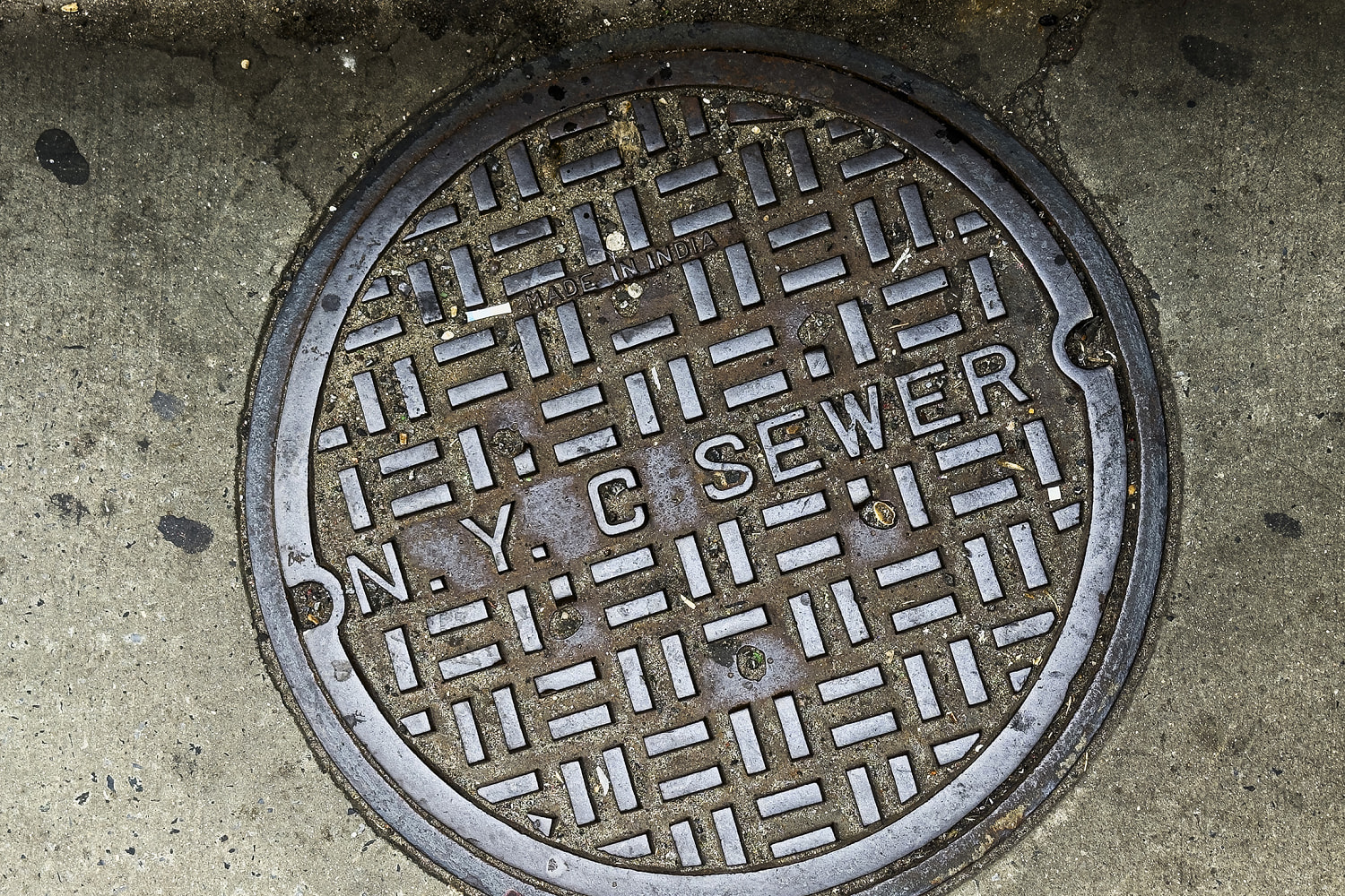 N.Y.C. Sewer Cover on City Pavement (Getty Images)