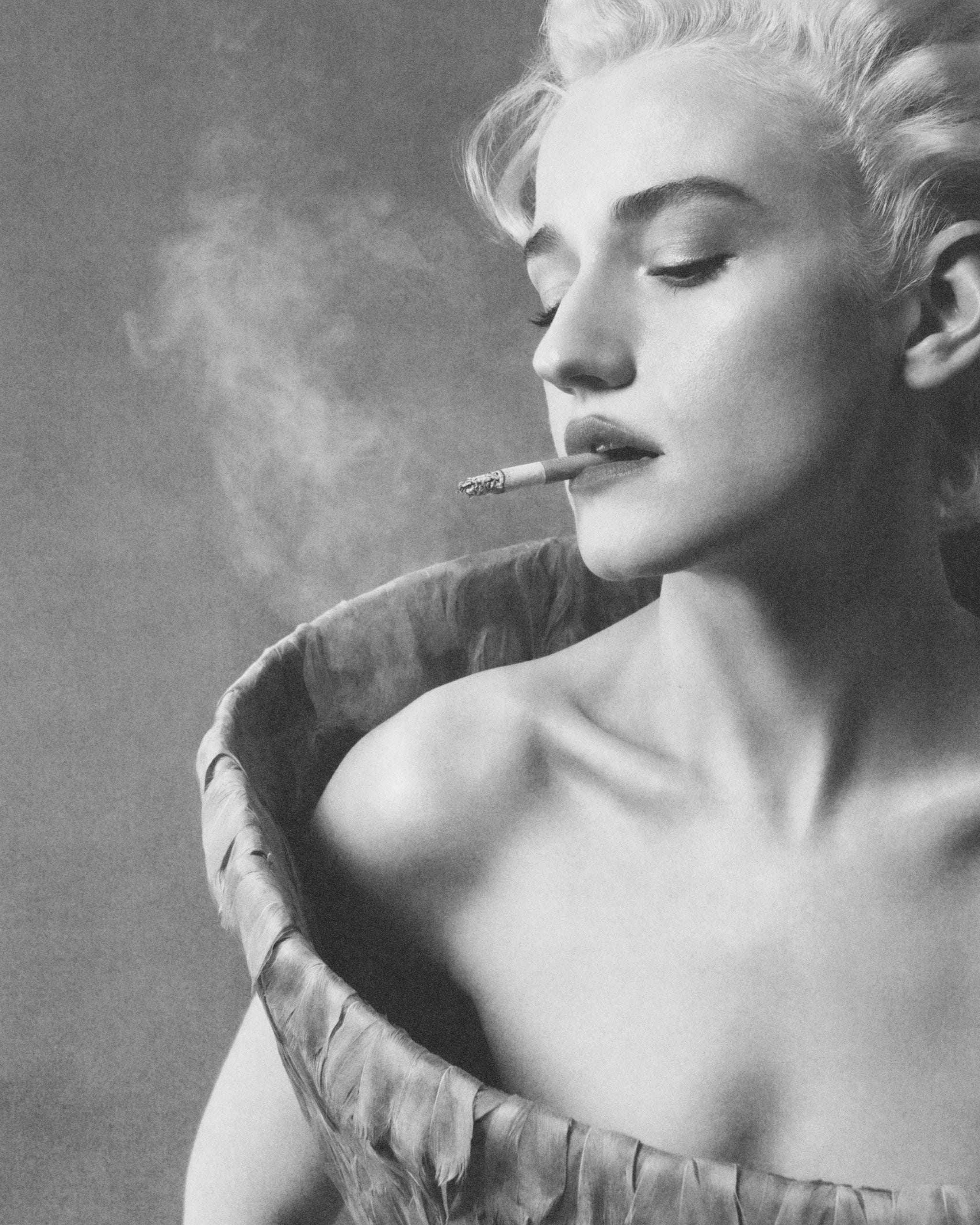 A portrait of a Julia Garner in a unique outfit, smoking a cigarette, with soft lighting and a smoky background.