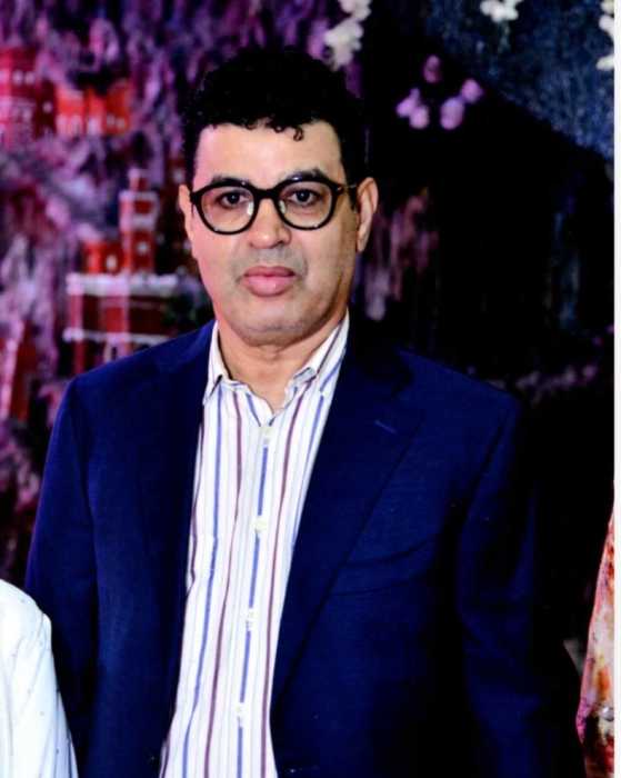 man wearing a suit and glasses