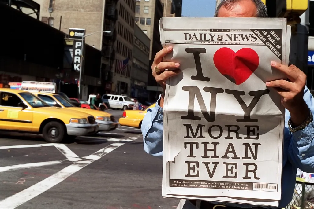 A man in New York City reads a copy of the September 19, 2001, issue of the Daily News.