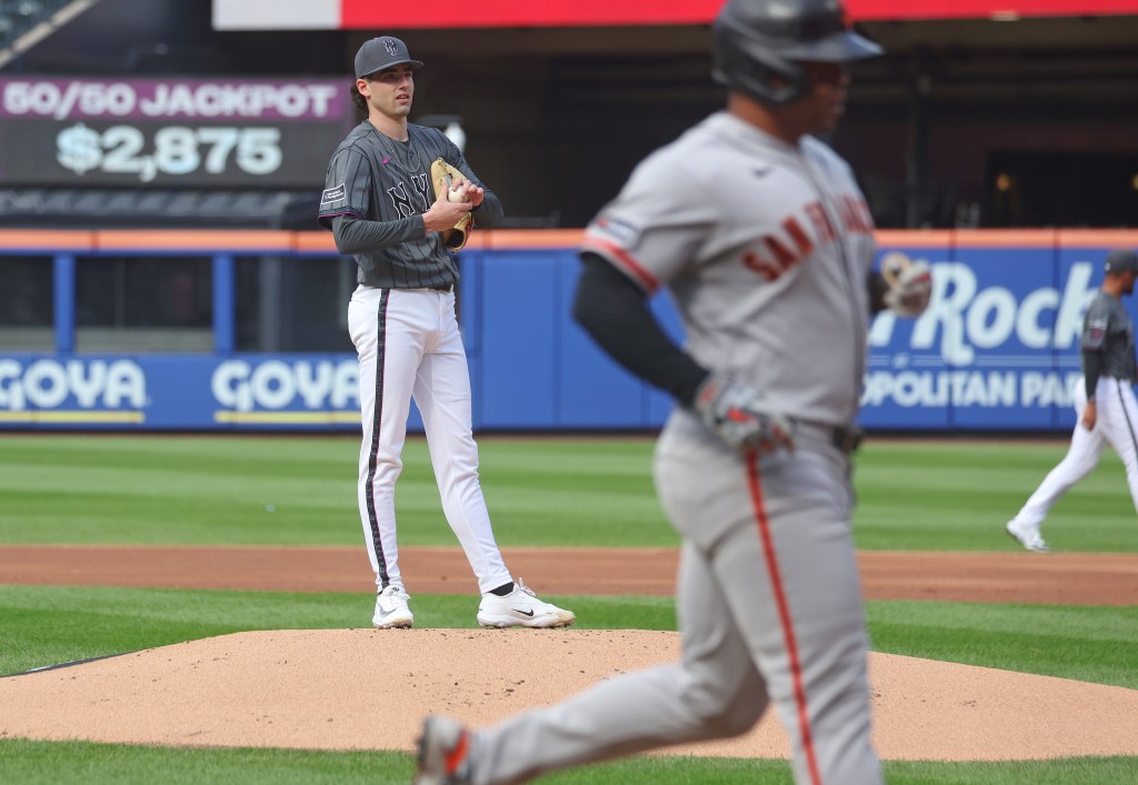 New York Mets pitcher Zac Thornton (49) watches as San Francisco Giants first baseman Rafael Devers (16) walks off the field.
