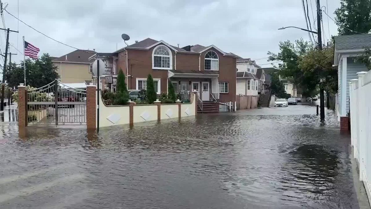 Queens man says he bought his Howard Beach home three days ago, as floodwaters rise around neighborhood