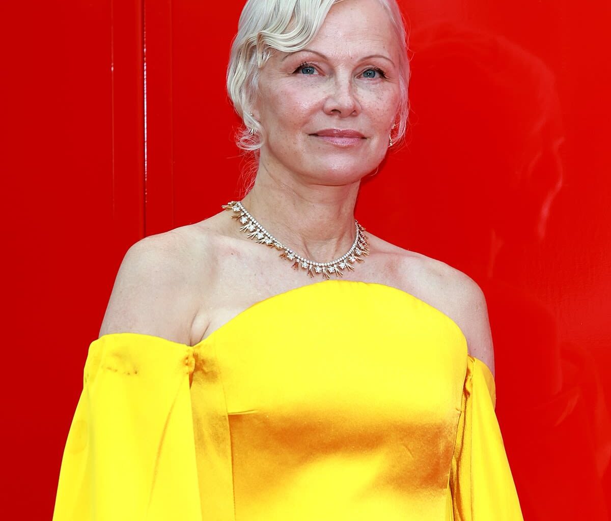Pamela Anderson Rocks Backless Dress With Extra-High Slit in NYC