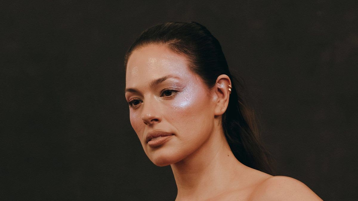 Ashley Graham showcases incredible curves in plunging satin dress inside luxurious NYC apartment