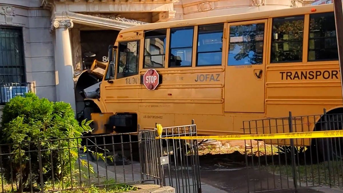 Video: School bus slams into New York City residential building