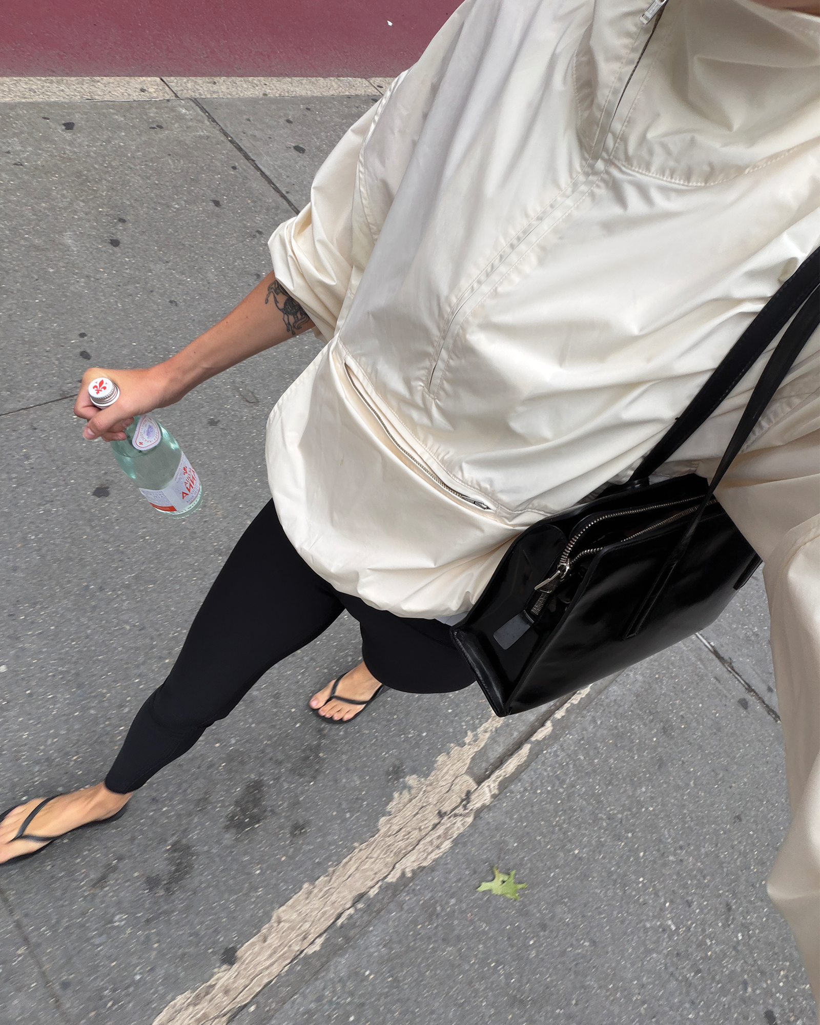 Eliza walking on the Upper West Side to pilates at Equinox.