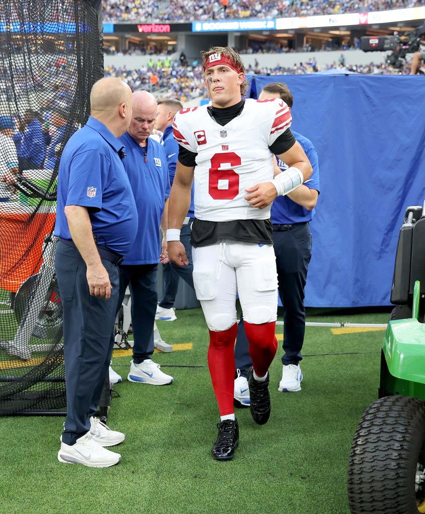 Giants quarterback Jaxson Dart (6) walks to the locker room after taking a hard hit during the first quarter of a game against the Los Angeles Rams at SoFi Stadium in Inglewood, California, Monday, Sept. 21, 2026.