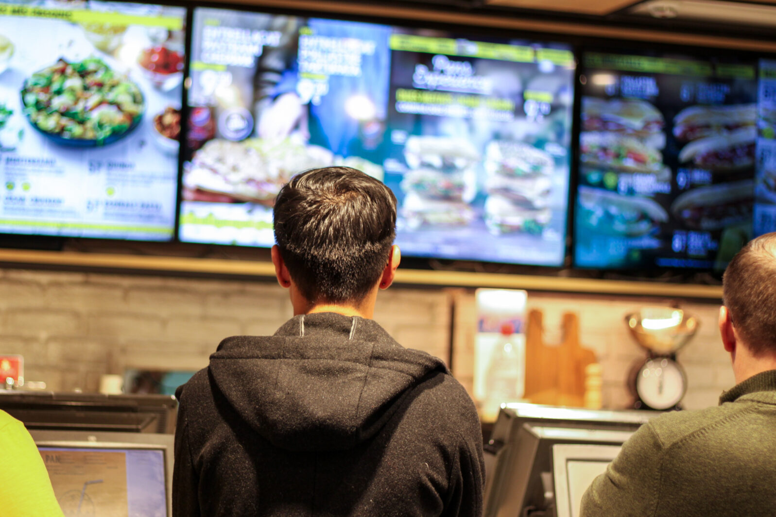 Man choosing which hamburger to eat from fast food restaurant