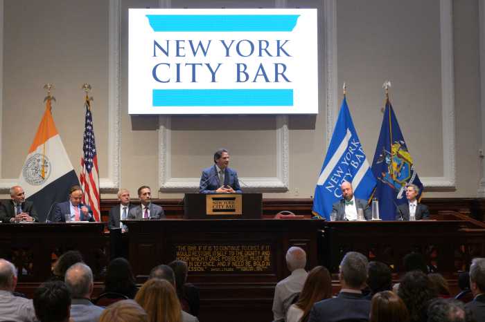 panelists speak to a group of people