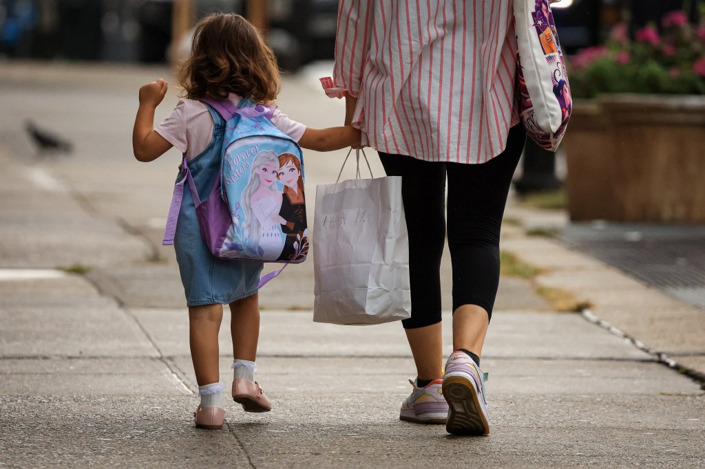 A mother walks her daughter to school on the first day of New York City Public Schools on Thursday, Sept. 10, 2026, in New York City.