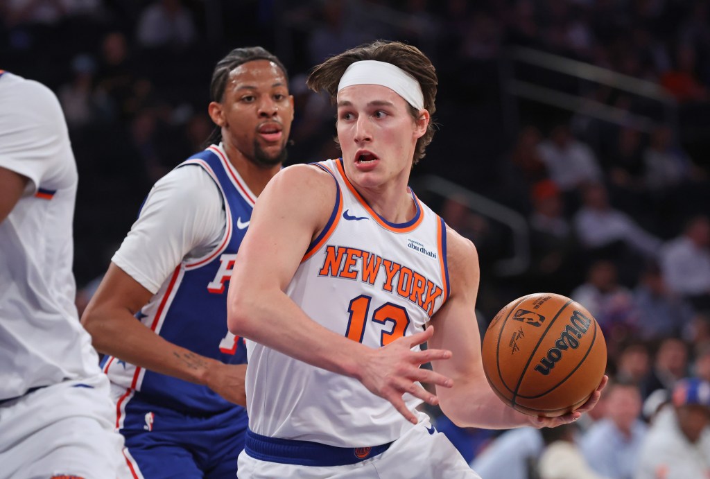 New York Knicks guard Tyler Kolek drives to the basket during a playoff game.