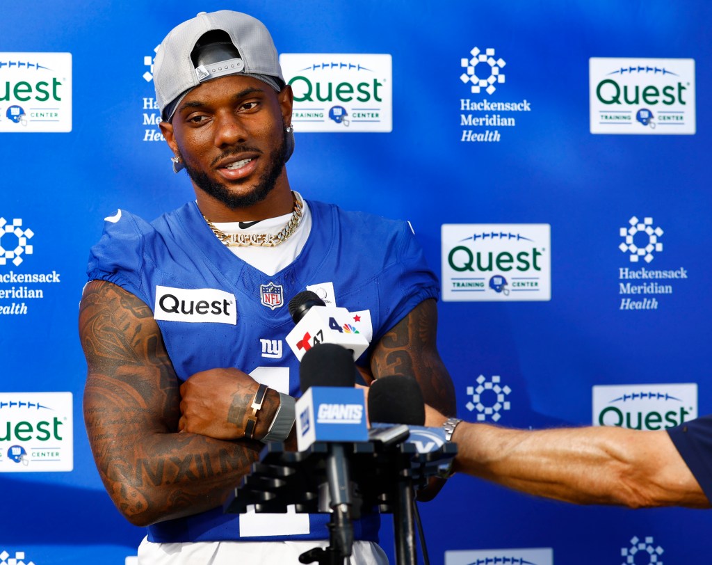 New York Giants wide receiver Malik Nabers answers questions from reporters during football practice.