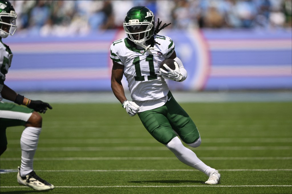 New York Jets wide receiver Omar Cooper Jr. (11) runs with the ball.