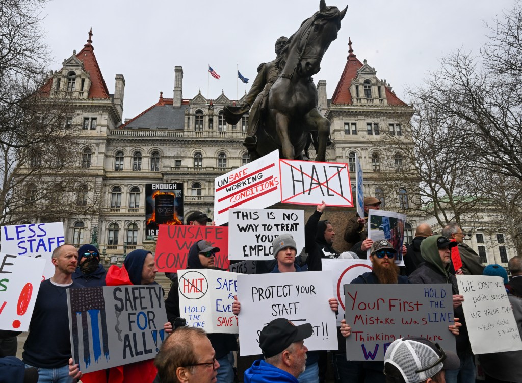 New York state correctional officers protest unsafe working conditions at a rally at the State Capitol.