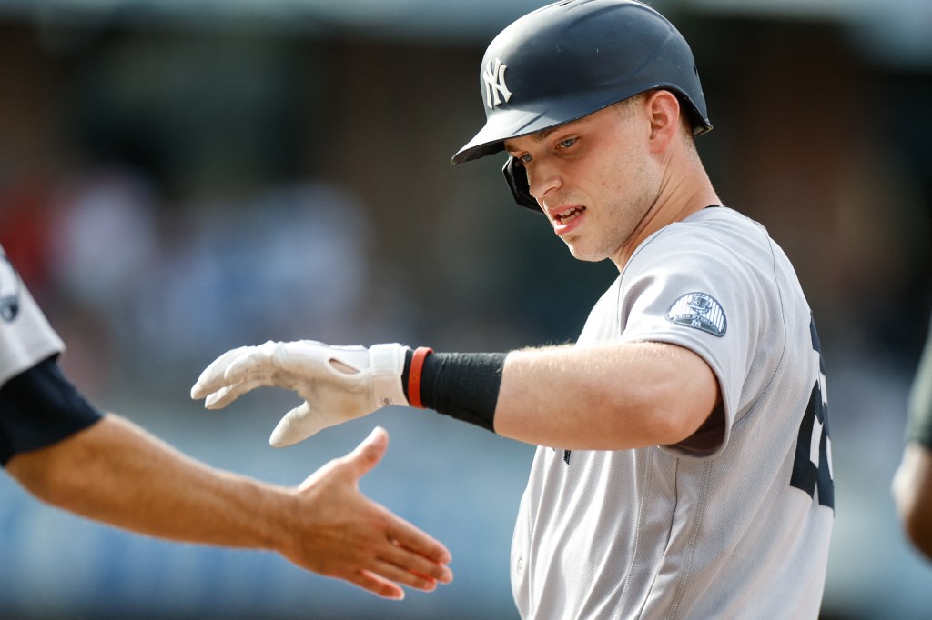 New York Yankees designated hitter Ben Rice celebrates after hitting a single.