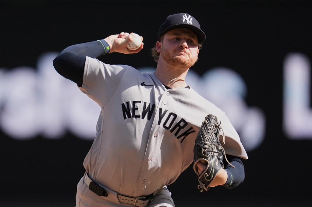 New York Yankees pitcher Clarke Schmidt throws a pitch.