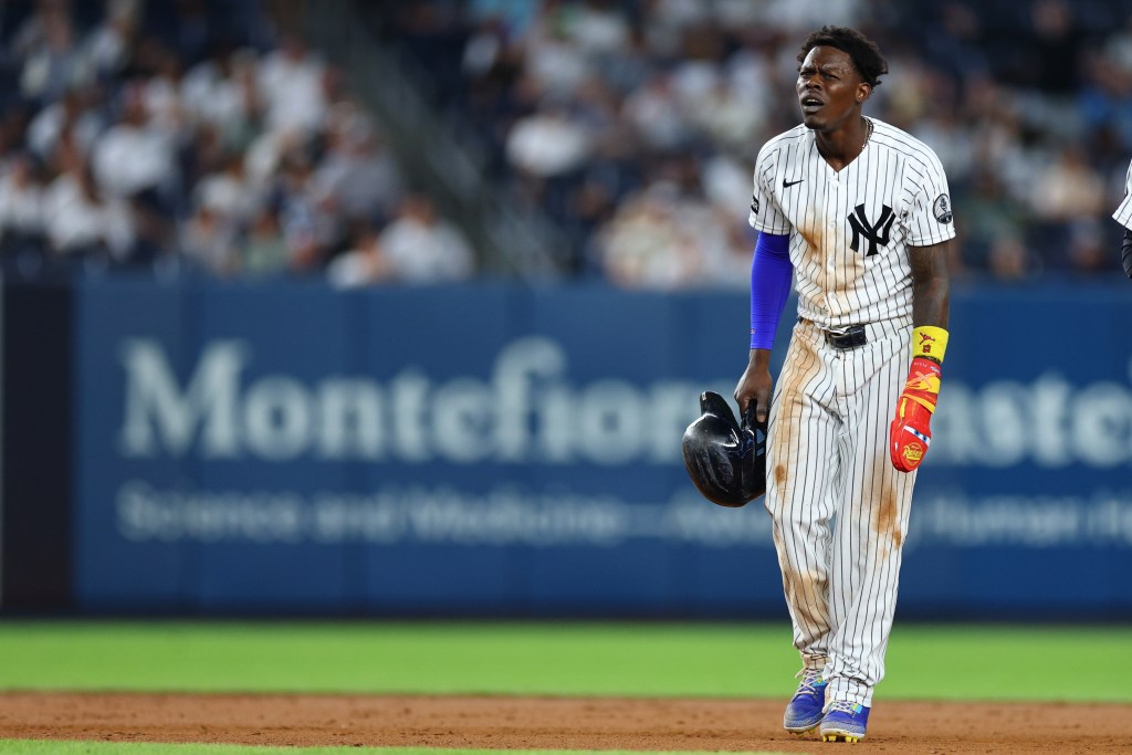 New York Yankees second baseman Jazz Chisholm Jr. reacts after a video review confirms an out at second base.
