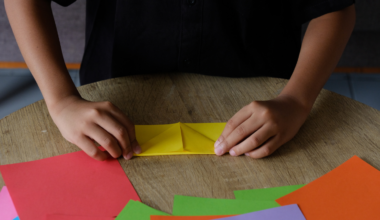 A 14-year-old in New York folded 54 variations of the same origami crease pattern and stacked dumbbells on them to see which collapsed — the winning fold held more than 9,000 times its own weight, the design is aimed at flat-pack disaster shelters, and it took the $25,000 top middle-school prize