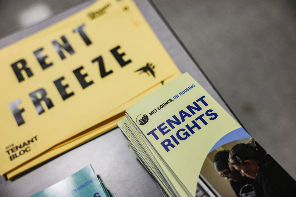 Pamphlets on tenant rights and flyers calling for a rent freeze on display.