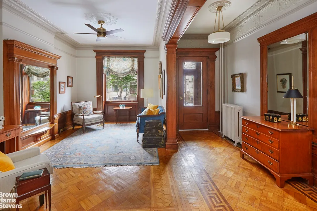 entry and front parlor with pier mirror, wood floor