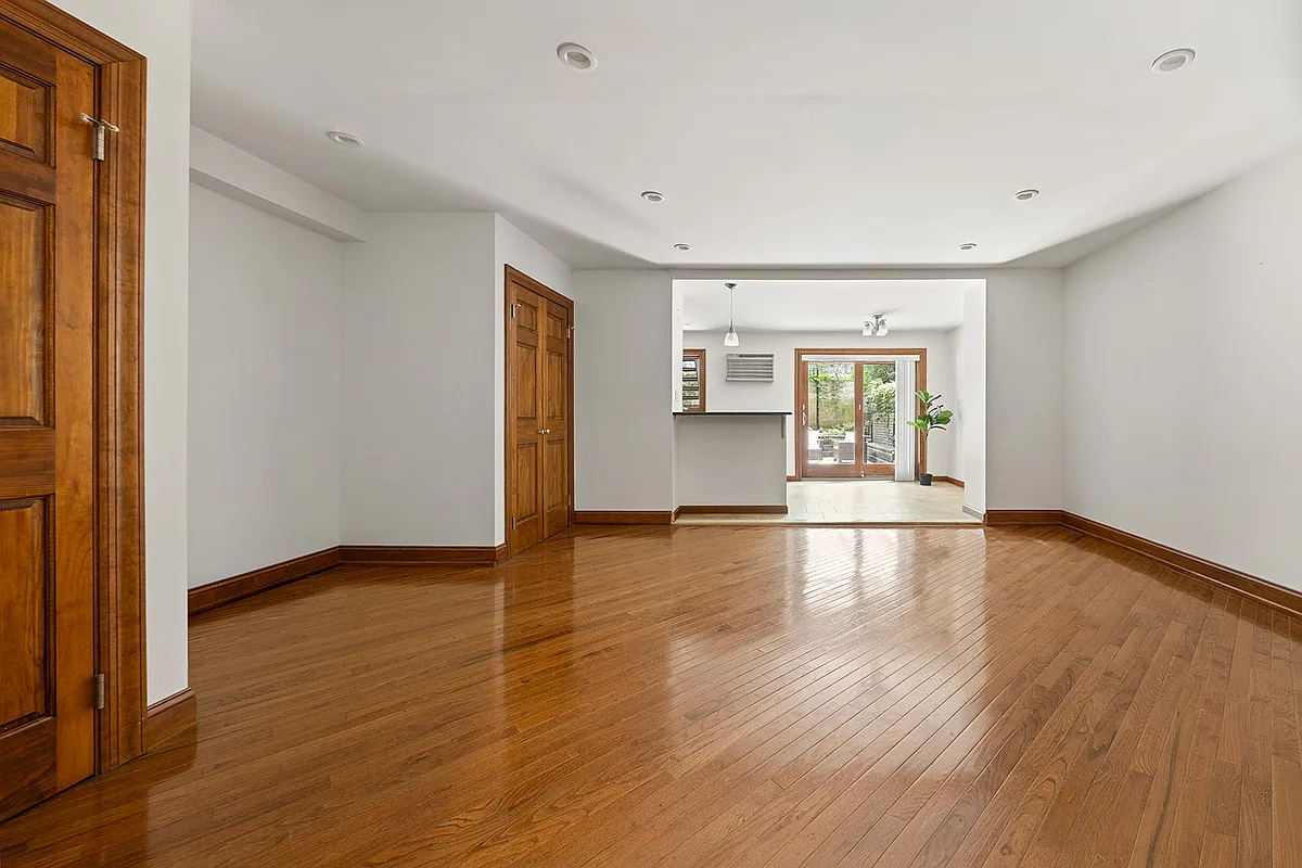 garden level with recessed lights, wood floor