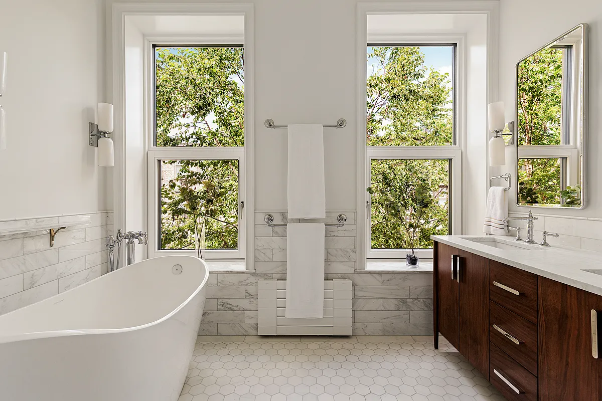 bathroom with a soaking tub
