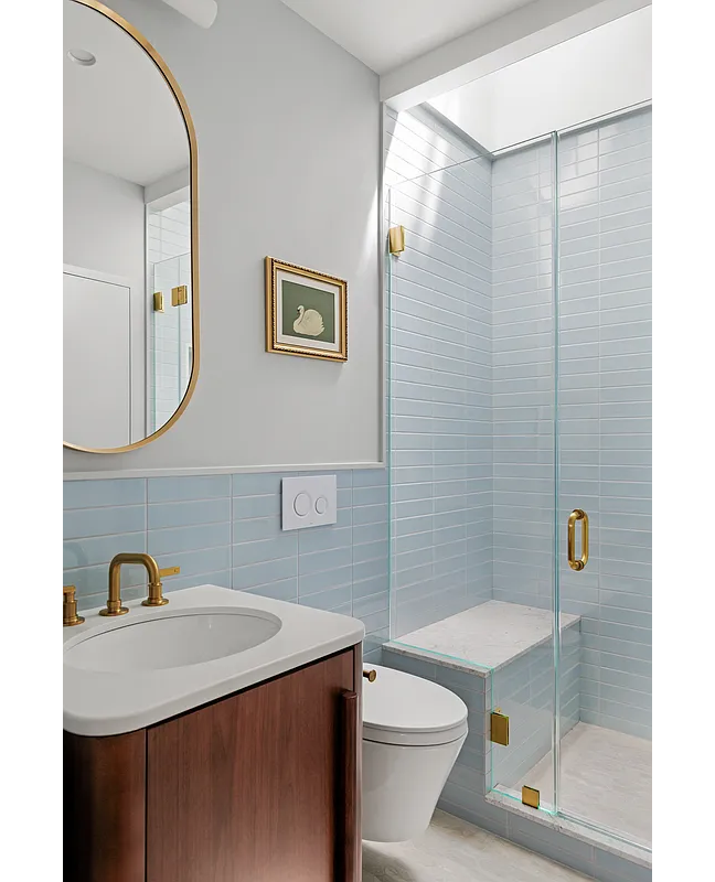 bathroom with walk-in shower with bench