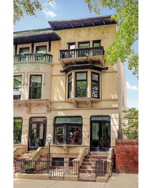 townhouse exterior with stoop, top floor balcony