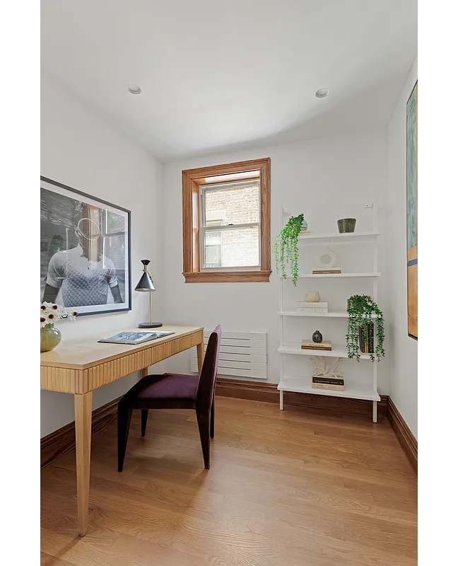 narrow room set up as an office