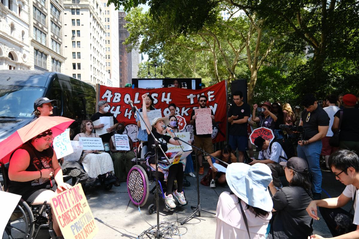 Raine Reilly speaks at a protest outside City Hall to end 24-hour shifts for home care workers in New York City.