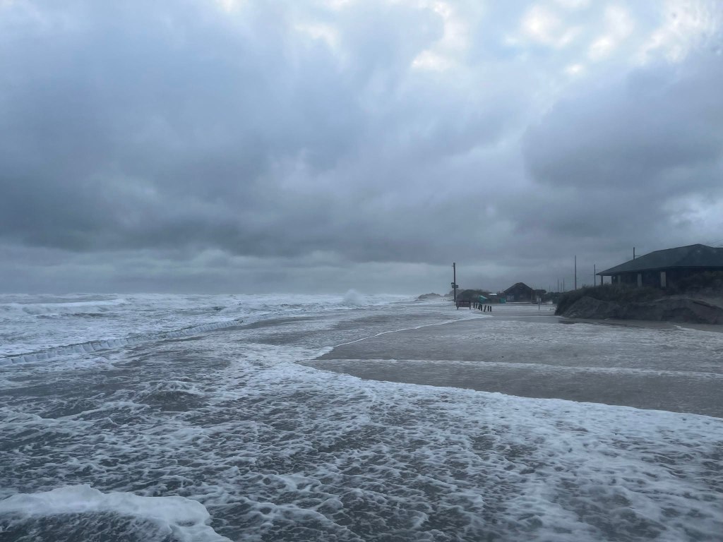 Pics from Pea Island this morning. The road is currently covered in 4' of water in some areas, as well as deep sand. At this point, it is impossible to assess the extent of any road damage, but once we do, we will have a better idea of repair/reopening options.