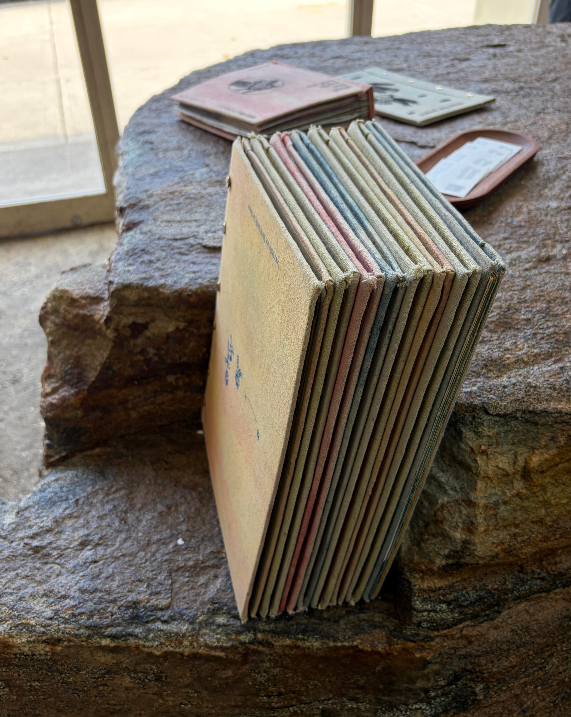 menu sit in the notch of a large rock at the entrance of brooklyn restaurant pizza 4p’s