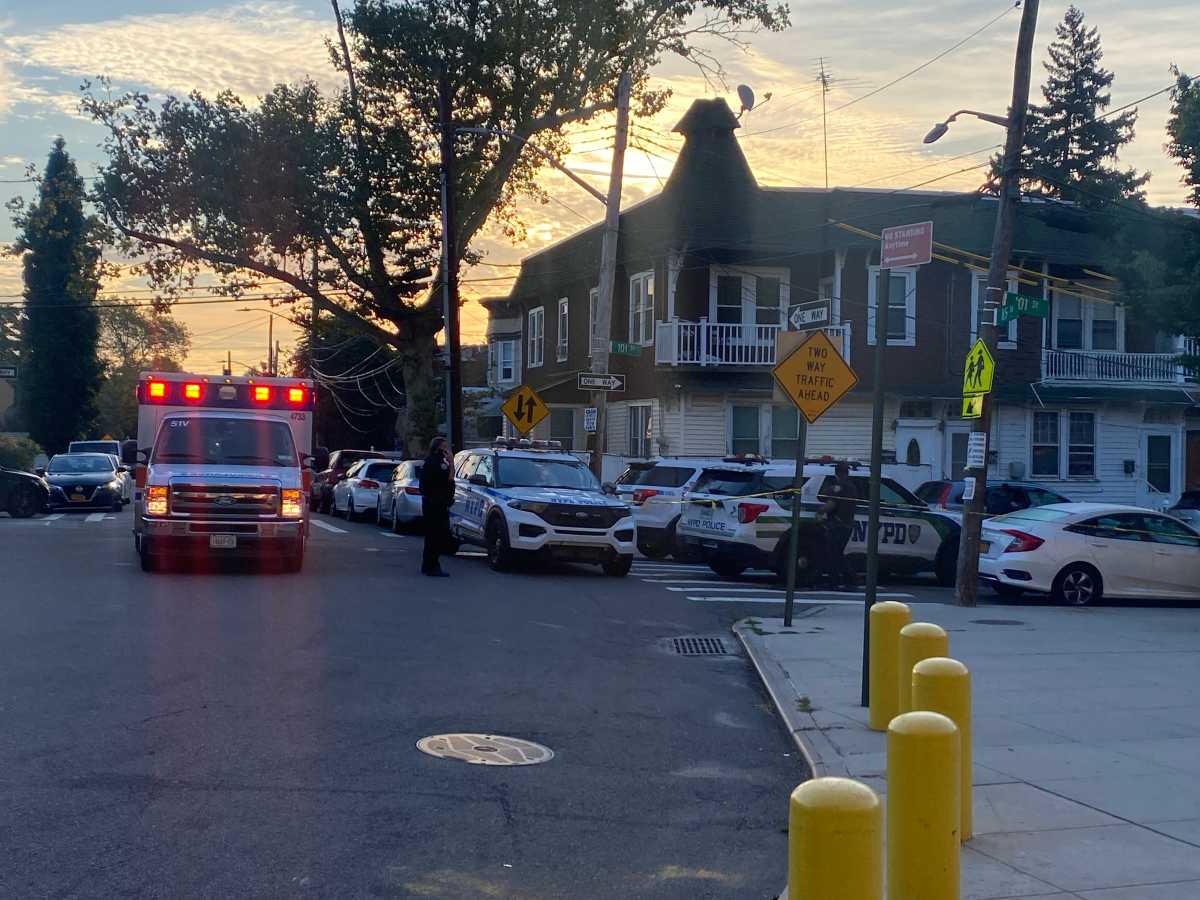 police officers at scene of Queens home invasion