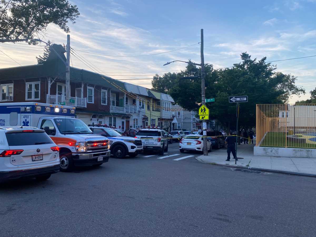 police officers at scene of Queens home invasion
