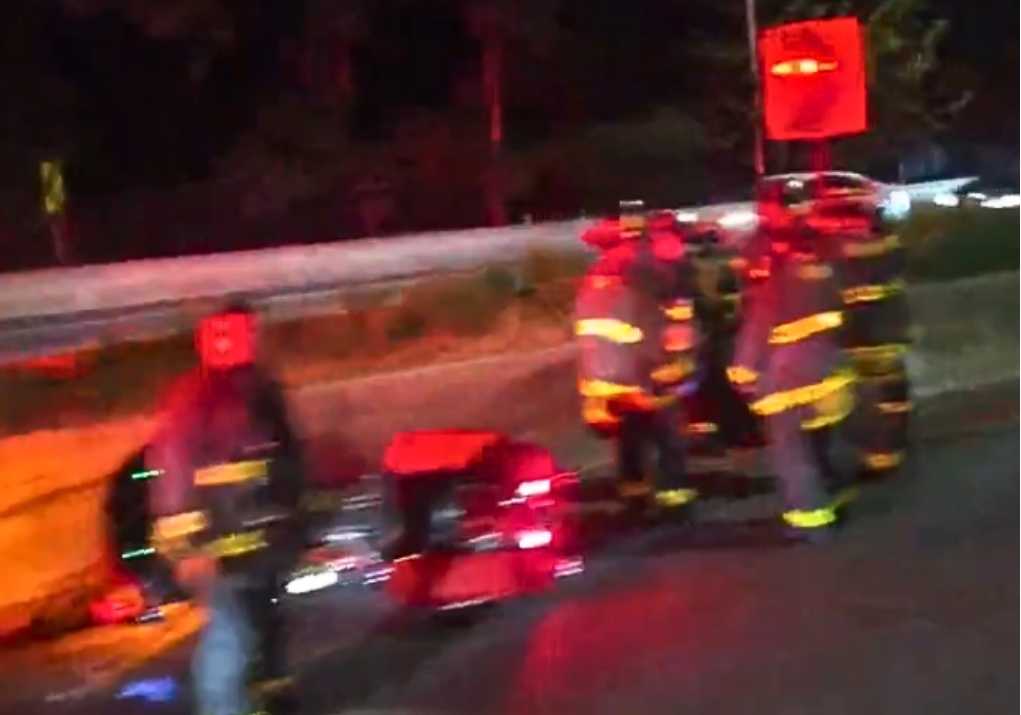 police and firefighters at scene of deadly queens motorcycle crash on jackie robinson parkway