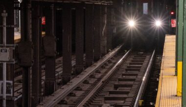 Young man and woman sit down together on Manhattan subway tracks, killed by train