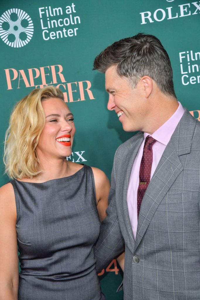 Scarlett Johansson and Colin Jost smiling at each other at the "Paper Tiger" premiere.