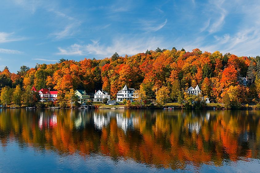 Aerial view of Saranac Lake, New York, in the Adirondack Mountains during the fall.
