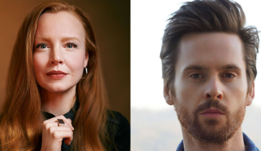 Side-by-side portraits of a woman with long red hair and a man with short brown hair and facial hair, both looking directly at the camera.
