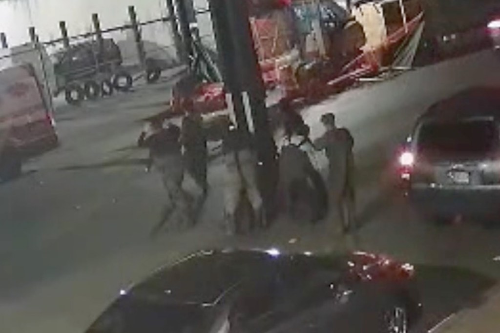 Several individuals emerge from a New York City manhole.