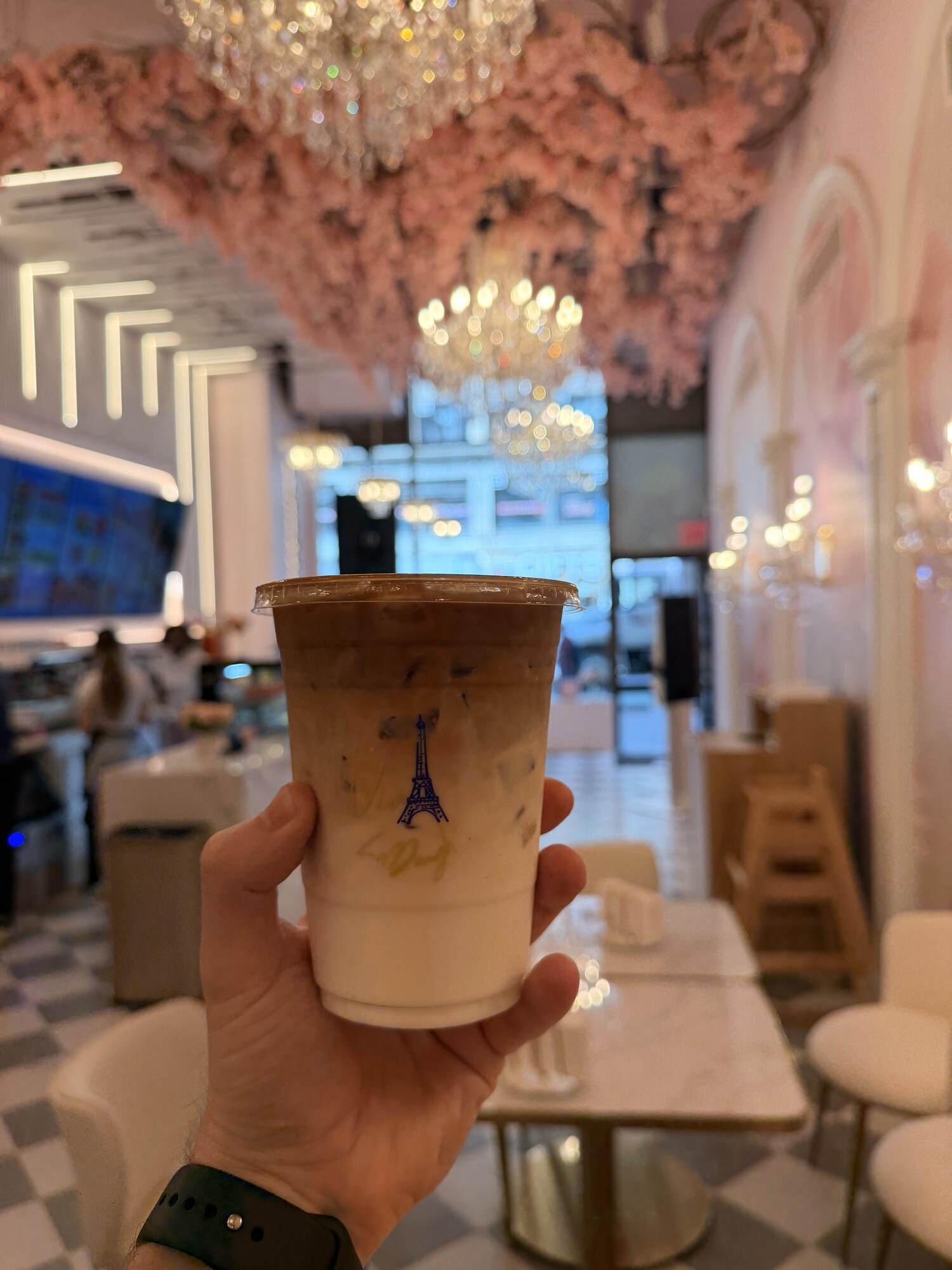 Iced latte inside Viva La Dough's pink Midtown Manhattan cafe